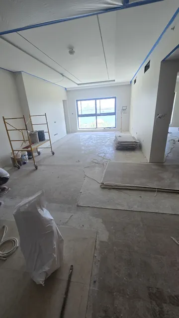 Suspended ceiling with light coves, taped and ready for finishing