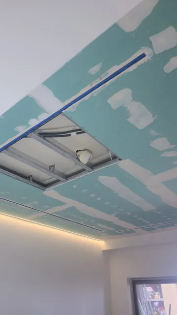 Suspended ceiling with light coves, taped and ready for finishing