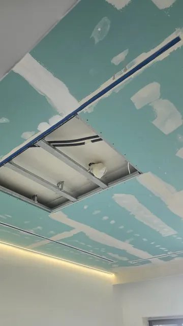 Suspended ceiling with light coves, taped and ready for finishing