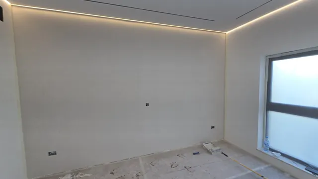 Room finished: painted walls, ceiling cove lighting and linear diffusers